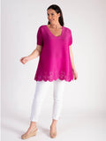 Elegant Fuschia Plissé Short Sleeve Top with Chic Hem Cut-Out Detail