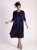 Radiant Grape: Pleated Dress with Floral Accents