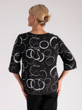 Black Circle Print Roundneck Top with Stepped Hemline