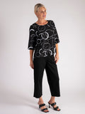 Black Circle Print Roundneck Top with Stepped Hemline