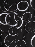 Black Circle Print Roundneck Top with Stepped Hemline